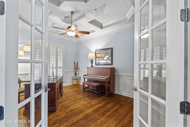 interior space with dark hardwood / wood-style floors, coffered ceiling, ceiling fan, crown molding, and french doors