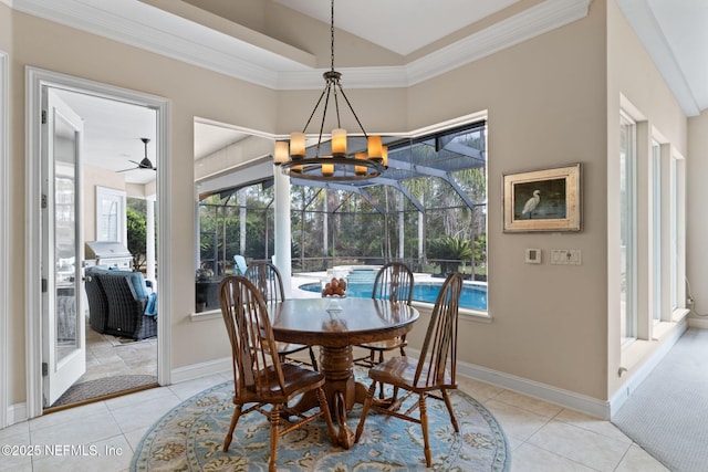 tiled dining room featuring crown molding and plenty of natural light