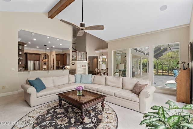 carpeted living room with ceiling fan with notable chandelier, ornamental molding, high vaulted ceiling, and beamed ceiling