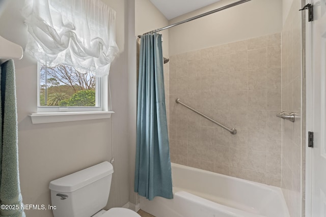 bathroom with shower / bath combo and toilet