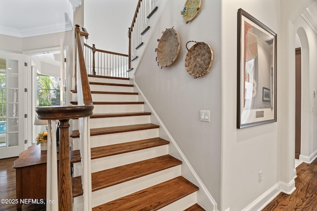 stairway featuring hardwood / wood-style flooring and ornamental molding