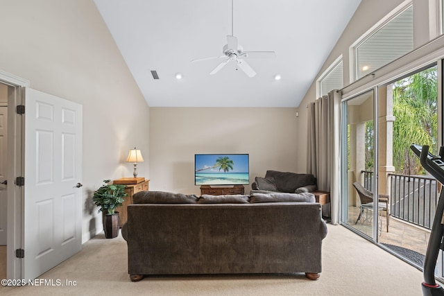 carpeted living room featuring ceiling fan and high vaulted ceiling