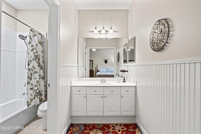 full bathroom with shower / bath combination with curtain, tile patterned floors, toilet, and vanity