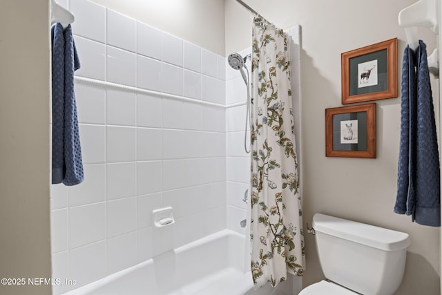 bathroom with shower / tub combo and toilet