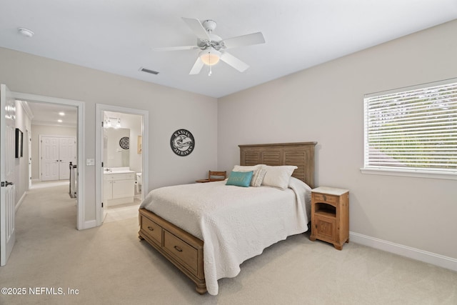 carpeted bedroom featuring ensuite bathroom and ceiling fan