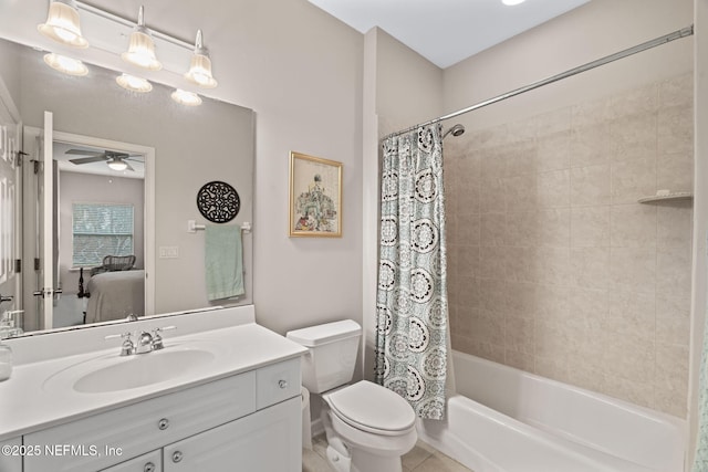 full bathroom with vanity, toilet, ceiling fan, and shower / bath combo with shower curtain