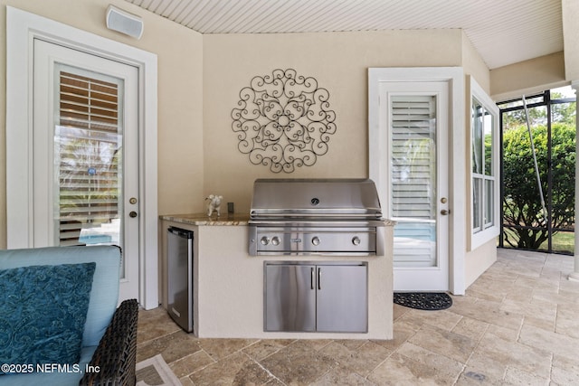 view of patio / terrace featuring grilling area and exterior kitchen