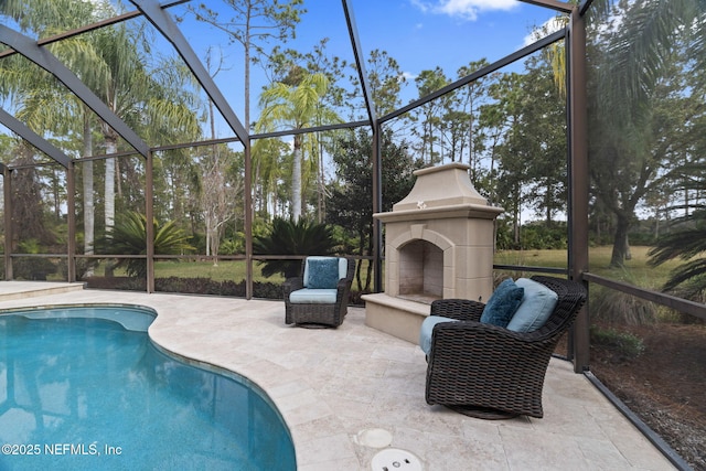 view of swimming pool featuring a fireplace and a patio area