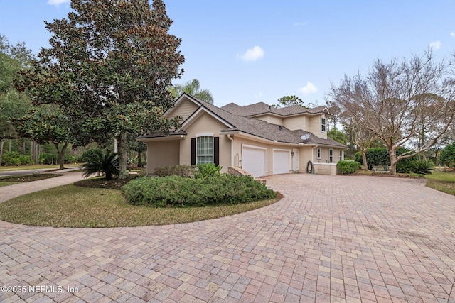 front facade with a garage