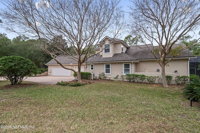 view of front of home featuring a garage and a front yard