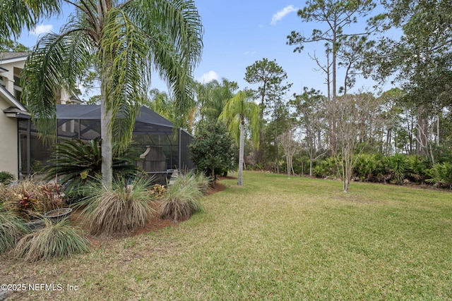 view of yard featuring a lanai