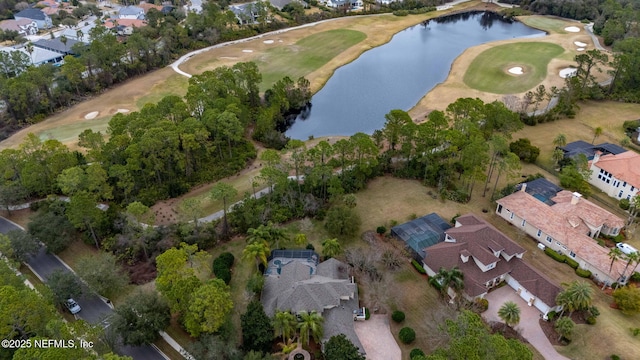 birds eye view of property with a water view