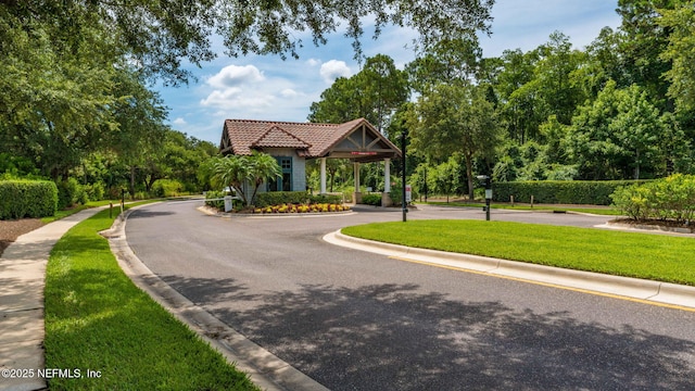 surrounding community featuring a lawn