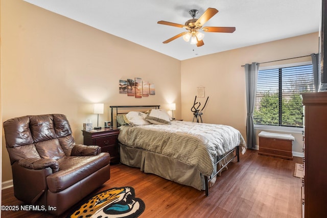 bedroom featuring dark hardwood / wood-style floors and ceiling fan