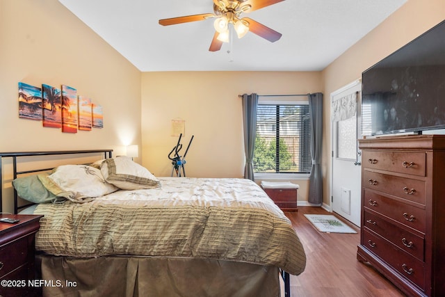 bedroom featuring wood-type flooring and ceiling fan