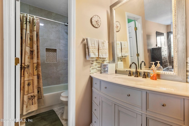 full bathroom featuring tasteful backsplash, shower / bath combo, vanity, and toilet