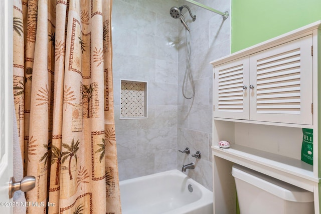 bathroom featuring shower / tub combo with curtain and toilet