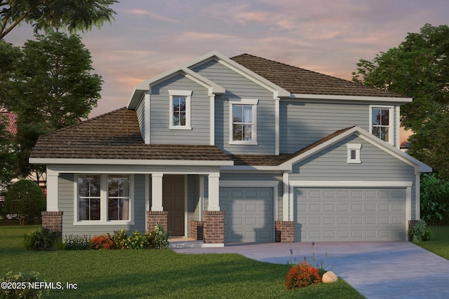 view of front facade with a garage and a lawn