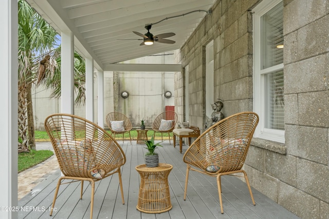 wooden terrace featuring ceiling fan