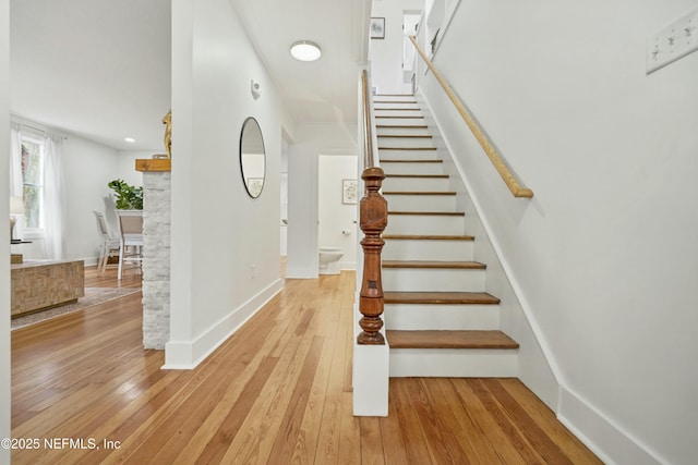 staircase featuring hardwood / wood-style flooring