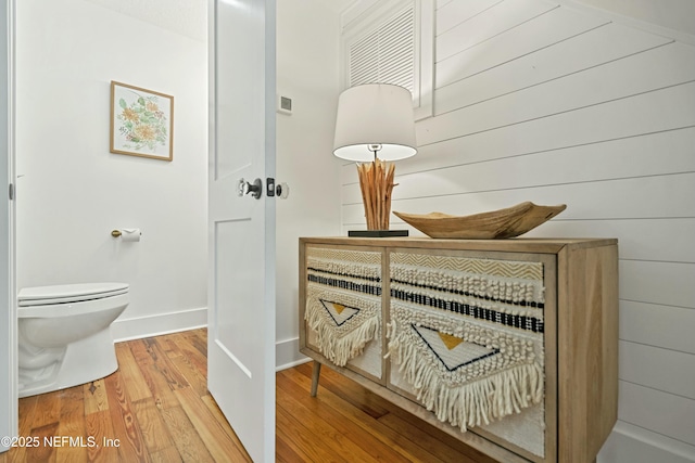 bathroom featuring toilet and hardwood / wood-style floors