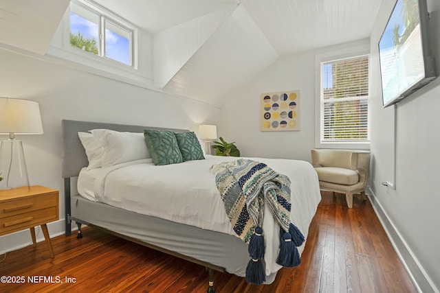 bedroom featuring vaulted ceiling and dark wood-type flooring