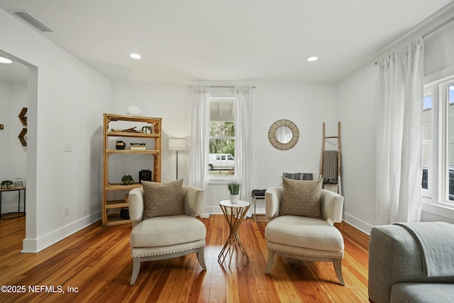 sitting room with hardwood / wood-style floors