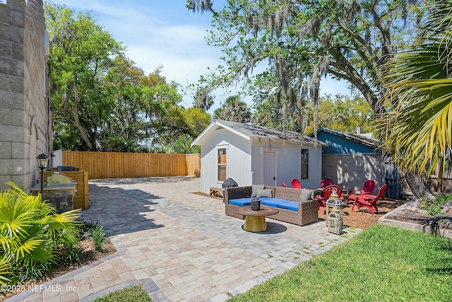 view of patio featuring an outdoor living space and an outdoor structure