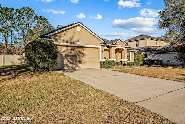 view of front of property featuring a garage and a front yard