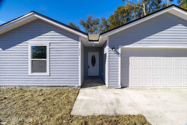 single story home featuring a garage