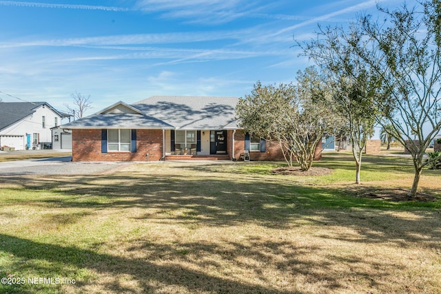 ranch-style home with a garage and a front yard