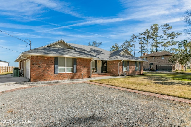 single story home with a garage, central AC, and a front yard