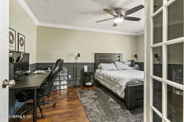 bedroom featuring crown molding, dark hardwood / wood-style floors, and a textured ceiling