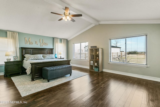 bedroom featuring ceiling fan, dark hardwood / wood-style floors, and vaulted ceiling with beams