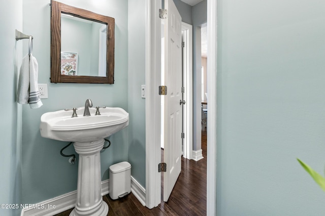 bathroom with wood-type flooring