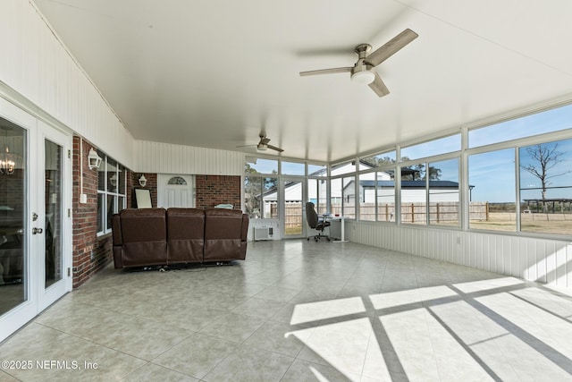 sunroom featuring ceiling fan