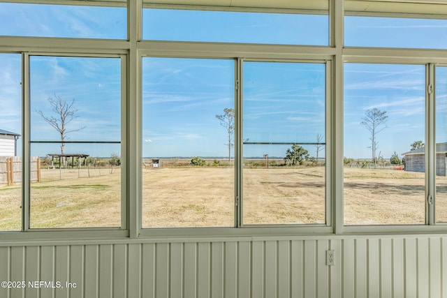 doorway to outside with a healthy amount of sunlight and a rural view