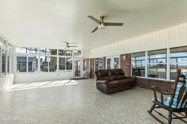 sunroom / solarium featuring ceiling fan