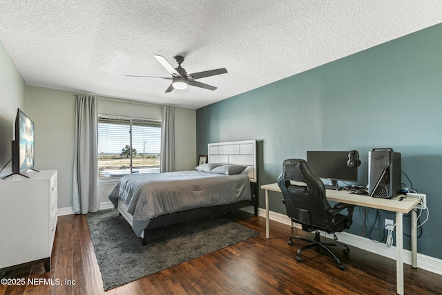 bedroom featuring ceiling fan, dark hardwood / wood-style floors, and a textured ceiling