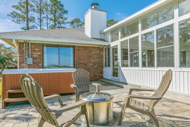 view of patio with a hot tub