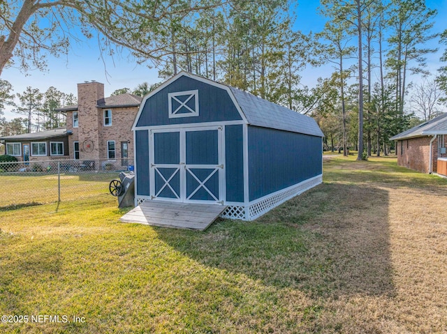 view of outbuilding featuring a yard