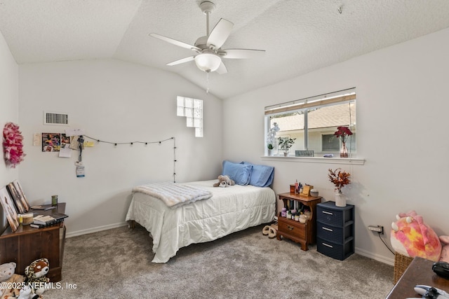 bedroom with lofted ceiling, ceiling fan, a textured ceiling, and carpet flooring