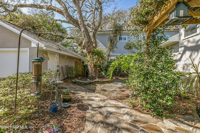 view of yard with a garage