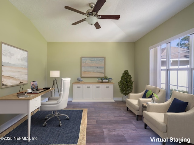 office space featuring ceiling fan, dark hardwood / wood-style flooring, and vaulted ceiling