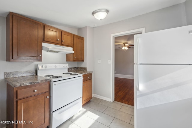 kitchen with light tile patterned flooring, ceiling fan, and white appliances