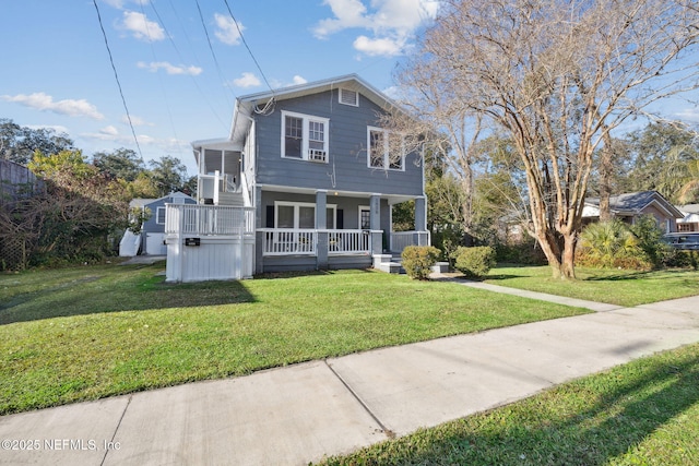 view of front of house featuring a front lawn and covered porch