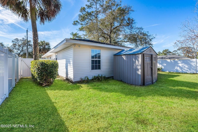 view of outbuilding featuring a yard