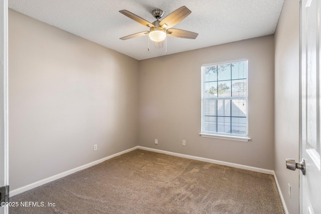 empty room featuring carpet, a textured ceiling, and ceiling fan