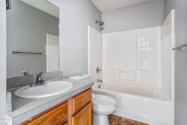 full bathroom featuring vanity, toilet, a textured ceiling, and shower / bathing tub combination