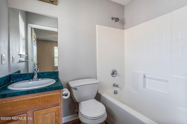 full bathroom featuring washtub / shower combination, vanity, and toilet